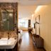 James Joyce Coffetel San Yuan LI Station Guangzhou room with vanity, bed and mirror