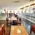 The Putra Regency Hotel in Kangar dining room with tables, chairs and buffet counter