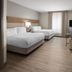 Candlewood Suites Aberdeen-Bel Air guest room with two beds, desk, TV and window in Bel Air
