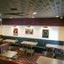 Apa Hotel Nagasaki Ekimae dining area with booth seating, tables, and wall art in Nagasaki