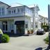 Trafalgar Lodge in Nelson, two-story hotel exterior with balcony and driveway