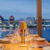 Harbor Hotel & Casino Curacao in Willemstad waterfront dining table with city lights and water view