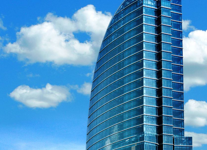 The Blue Sky Hotel and Tower in Ulaanbaatar, modern glass tower above traditional rooftops