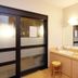 Hotel Route-Inn Utsunomiya Miyukicho bathroom vanity with double sinks and frosted shower doors