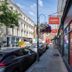 Easyhotel Paddington in London on a busy street with storefront signage and parked cars