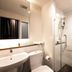 Sumittaya Chiangmai Hotel bathroom in Chiang Mai with sink, toilet and glass-enclosed shower