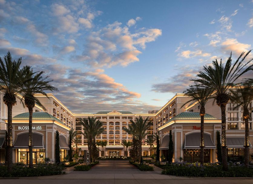 The Westin Anaheim Resort in Anaheim with palm-lined courtyard and sunset sky