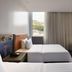 Hampton by Hilton Bogota Usaquen guest room with two beds and window view in Bogotá