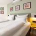Garner Hotel Oberhausen By IHG guest room with twin beds and framed wall art