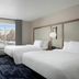 Fairfield by Marriott Inn & Suites Hailey Sun Valley room with two beds and a window view of snowy mountains