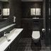 ibis Tallinn Center bathroom with sink, toilet, mirror and walk-in shower in Tallinn