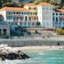 Hotel Del Golfo in Finale Ligure overlooking a rocky beach and turquoise sea