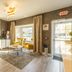 The Westfield Inn, BW Signature Collection lobby with yellow chairs, coffee table and large windows in Westfield