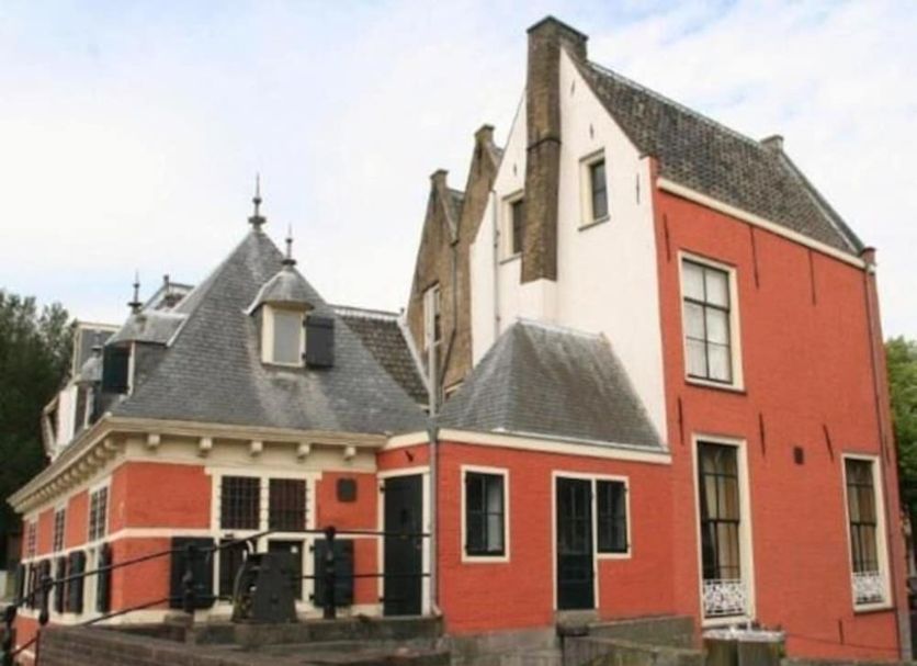De Utrechtsche Dom in Gouda, red historic hotel building with steep gabled roofs