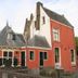 De Utrechtsche Dom in Gouda, red historic hotel building with steep gabled roofs