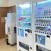 Toyoko Inn Hokkaido Tomakomai Ekimae vending machines and a water dispenser in a hallway, Tomakomai