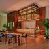 HOLLYWOOD VOLUME, a Tribute Portfolio Hotel in Los Angeles lobby with long table, bar and plants