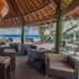Maitai Rangiroa in Avatoru with thatched beachfront bar seating and ocean views