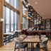 Metcalfe Montreal bar and lounge in Montreal with tall windows, wood floors, and modern seating
