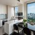 137 Pillars Residences Bangkok apartment kitchen and dining area with Bangkok skyline views
