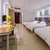 Liuhu Hotel (Hot Spring Garden Hotel) in Dezhou room with three beds and desk