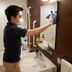 Premier Resort Yuga Iseshima bathroom staff cleaning sink and mirror in Shima