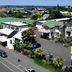Midtown Motor Inn in Whanganui, aerial view of motel buildings, parking area, and roadside sign