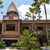 B Square Hotel at Khanom exterior with palm trees and a pointed tower in Khanom