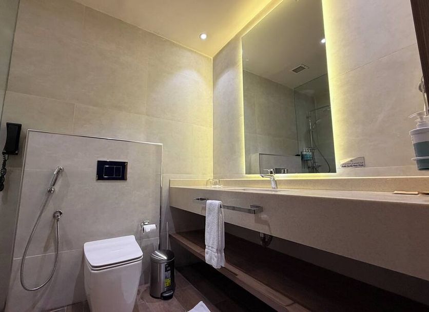 Sunday Hotel Al Olaya Formerly Novotel Suites Riyadh Centre bathroom with walk-in shower and vanity