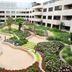 Beijing Hwa Apartment Hotel courtyard garden in Beijing with winding paths and landscaping