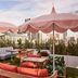Rooftop lounge at AC Hotels by Marriott San Diego Downtown Gaslamp Quarter with pink umbrellas and city views