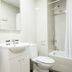 Residencia Universitaria Resa Los Abedules bathroom in Pamplona with sink, toilet, and bathtub shower