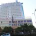 Jinluowan Hotel in Ji'an, a tall high-rise hotel with trees and cars in front