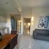 Hotel Costa Linda Beach Boca Chica: bright apartment-style room with dining table, sofa, and kitchen area