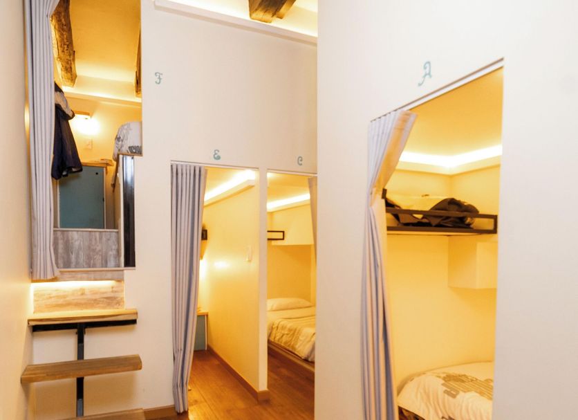 The Cranky Croc Hostel Bogotá dorm room with bunk beds and wooden floors