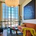 HOLLYWOOD VOLUME, a Tribute Portfolio Hotel in Los Angeles, lounge with city-view window and modern decor