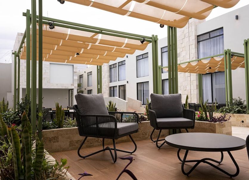 La Posada Hotel & Suites in San Luis Potosí outdoor courtyard seating with pergola shade