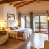 Reserva del Saja Hotel & Spa in Renedo de Cabuérniga: bright room with balcony, wood beams and sitting area