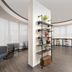 Crowne Plaza San Antonio Airport lobby lounge with curved windows, bar seating and modern chairs