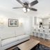 Westgate Historic Williamsburg Resort in Williamsburg living area with white sofa, coffee table, kitchen island and bar stools