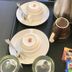 Katero in Pokhara: tea and coffee setup with kettle, cups, saucers, spoons, and Nescafe sachets