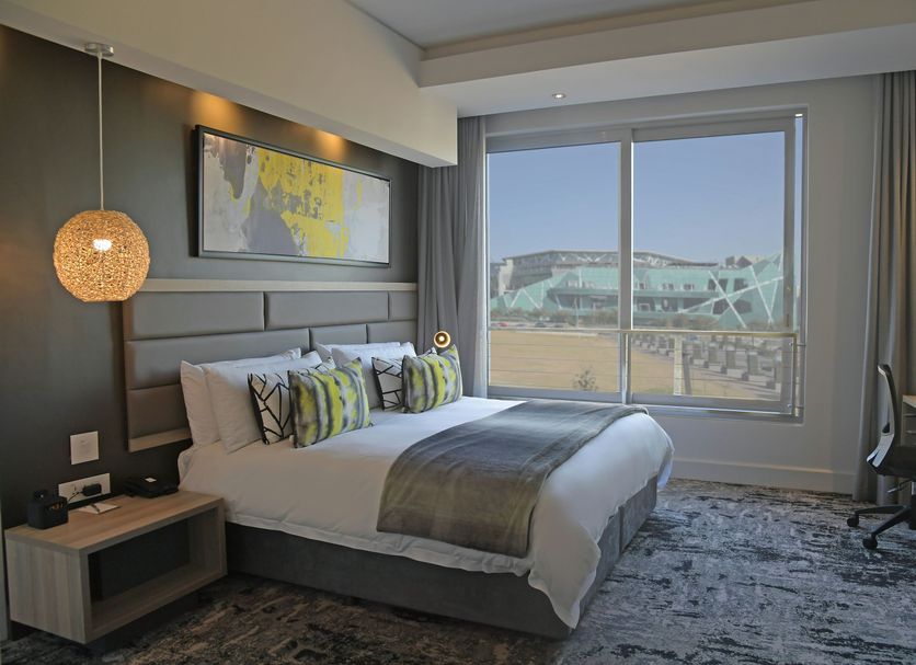 The Capital Menlyn Maine Pretoria guest room with king bed and large window view