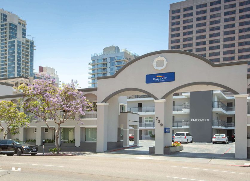 Baymont by Wyndham San Diego Downtown entrance with arched gateway and city towers in San Diego