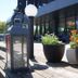 Hotel Hp Park Olsztyn entrance terrace with lantern, globe light and potted flowers in Olsztyn