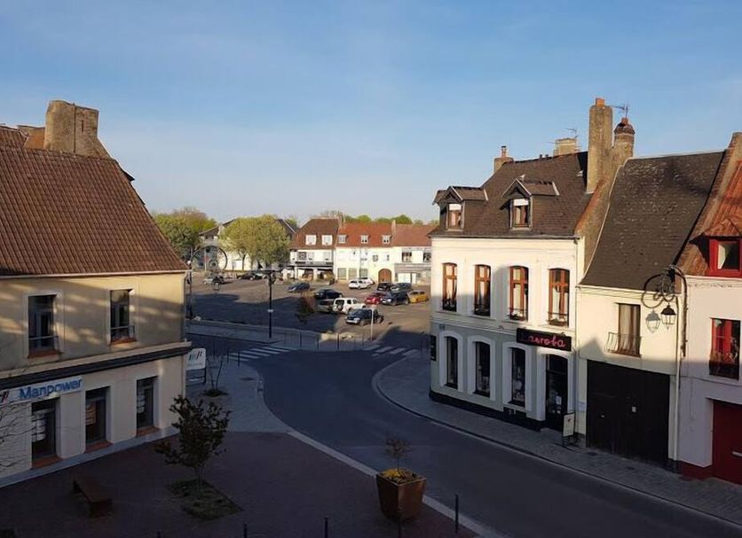 Les Remparts in Montreuil, street view of the hotel on a quaint town square