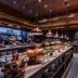Nysa Hotel Bangkok Sukhumvit 11 breakfast buffet with warm lighting and multiple food stations in Bangkok