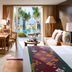 Mandarin Oriental, Sanya guest room with balcony, pool view and tropical garden beyond