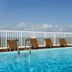 Intercity João Pessoa rooftop pool with lounge chairs and ocean view in João Pessoa