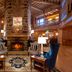 The Grand Hotel Golf Resort & Spa, Autograph Collection lobby with stone fireplace and vaulted wood ceiling in Point Clear