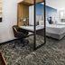 SpringHill Suites by Marriott Phoenix Goodyear guest room with two beds, workspace, and floor-to-ceiling window